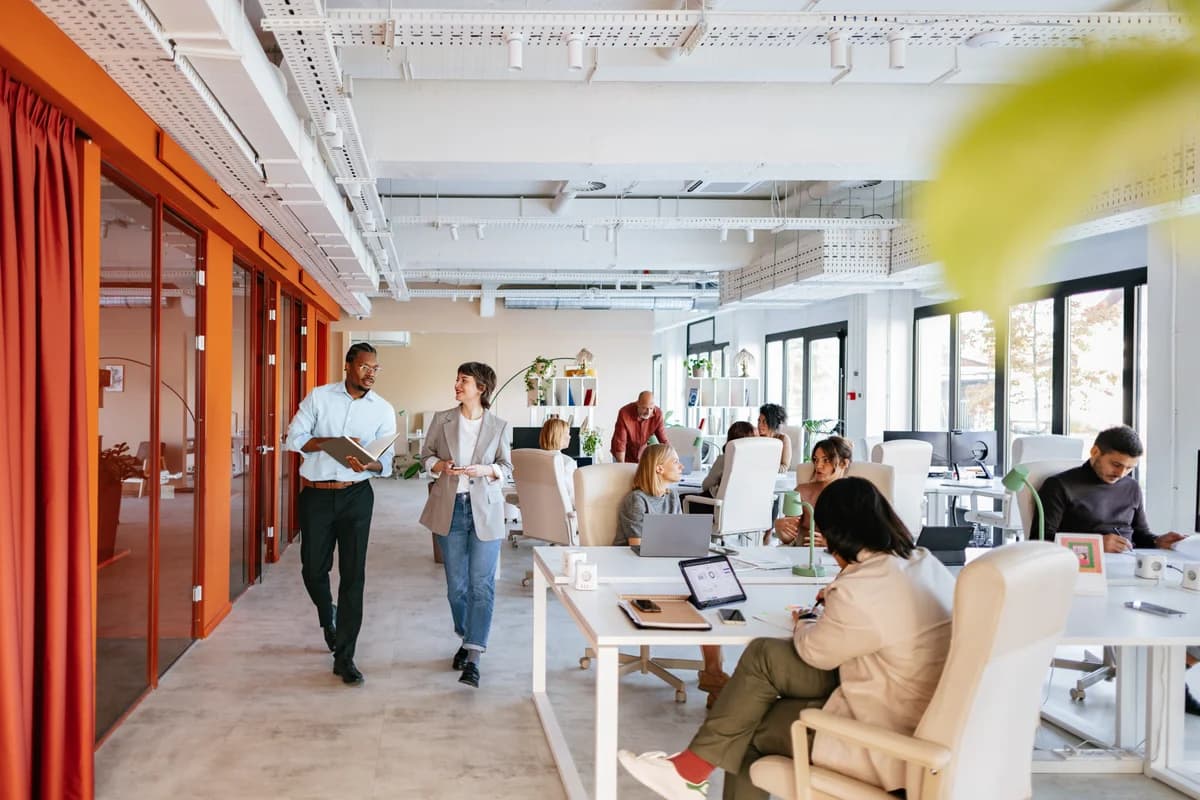 Modern collaborative workspace with a diverse team of professionals working together